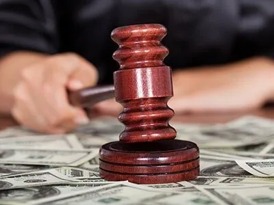 Judge using gavel and bills